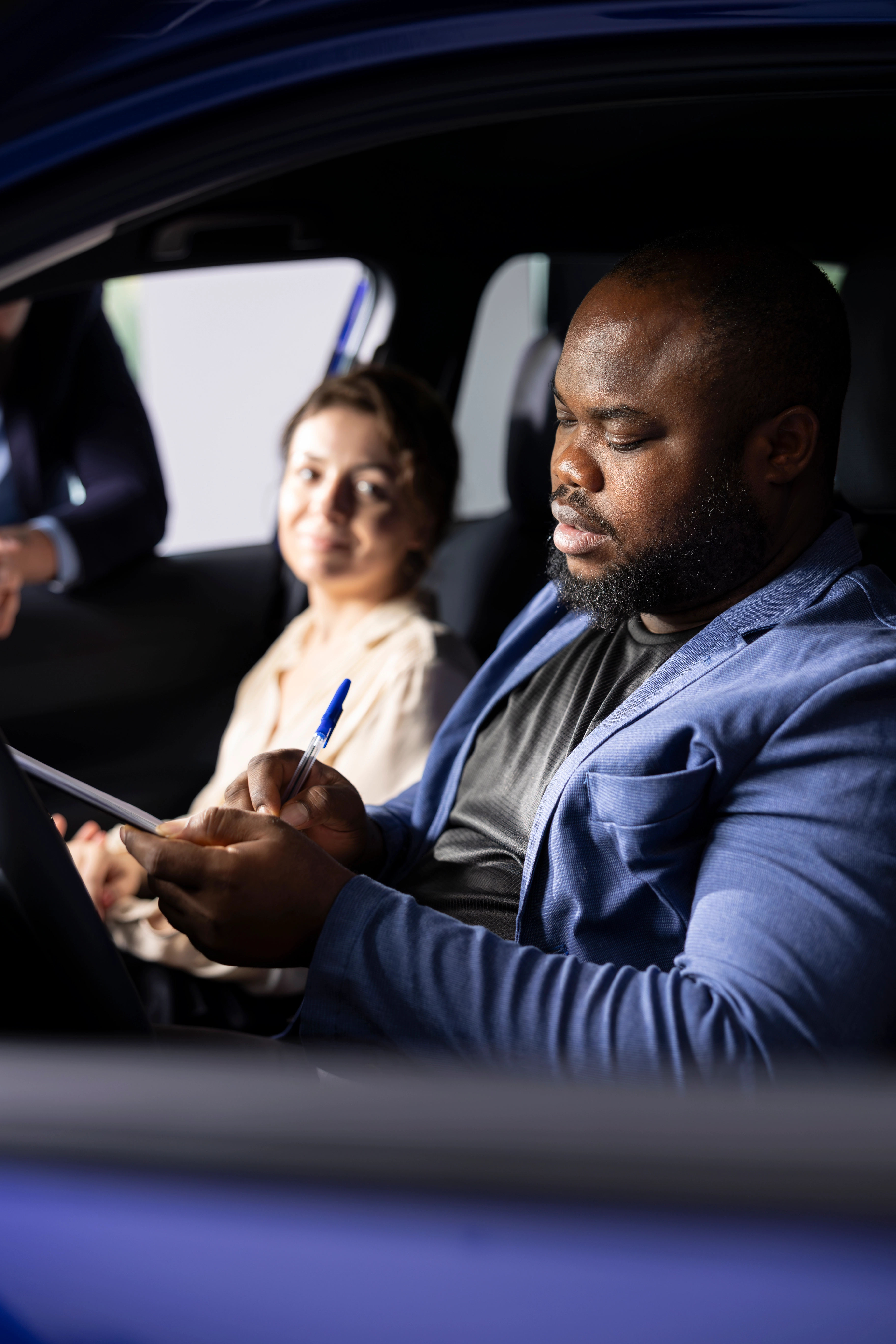 Professional driving instructor teaching student